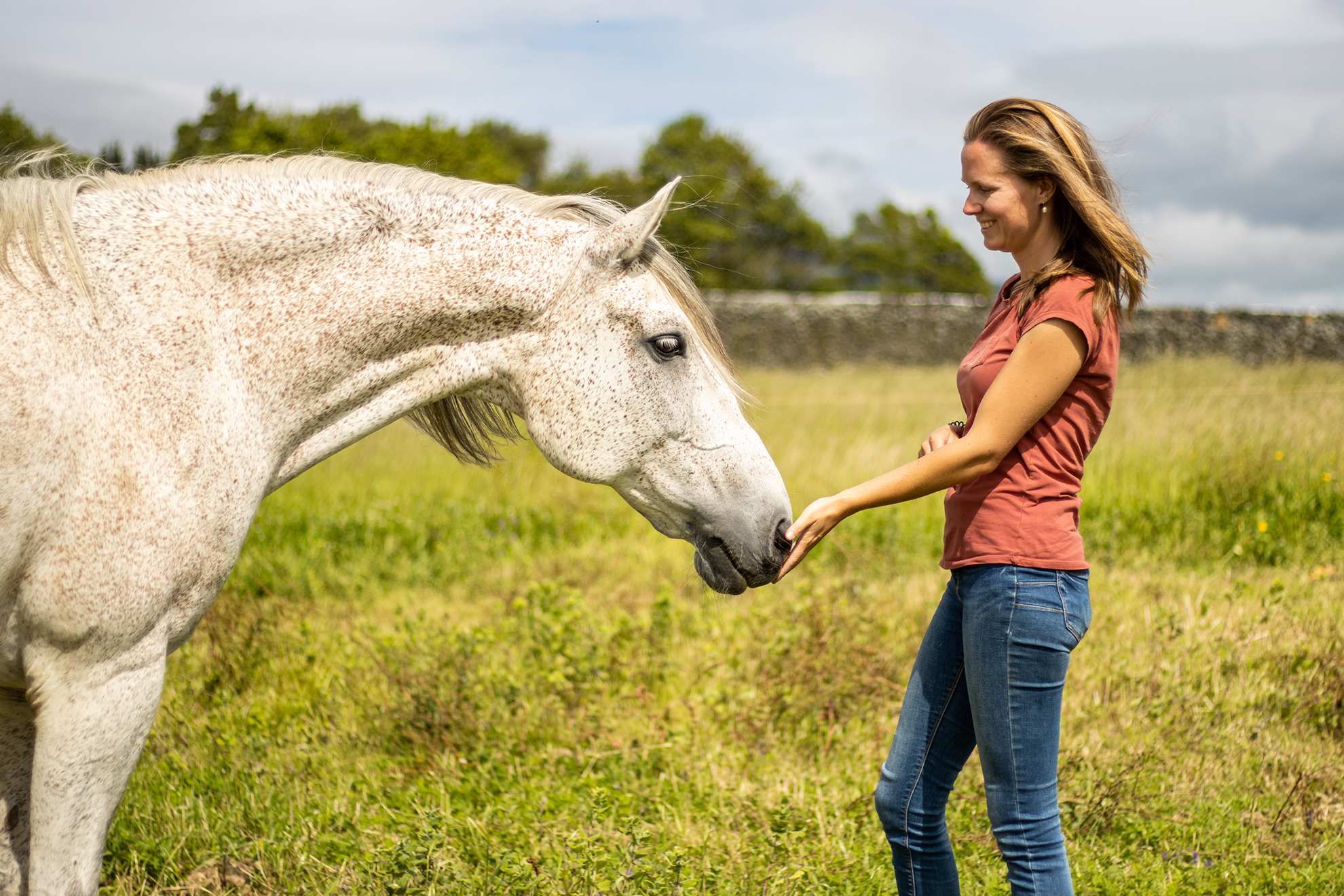 Girl with white horse, outdoors, trustful friendship, farm animals.